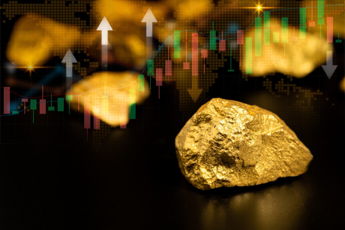 A computer-generated graphic depicting some gold nuggets and a stock price chart