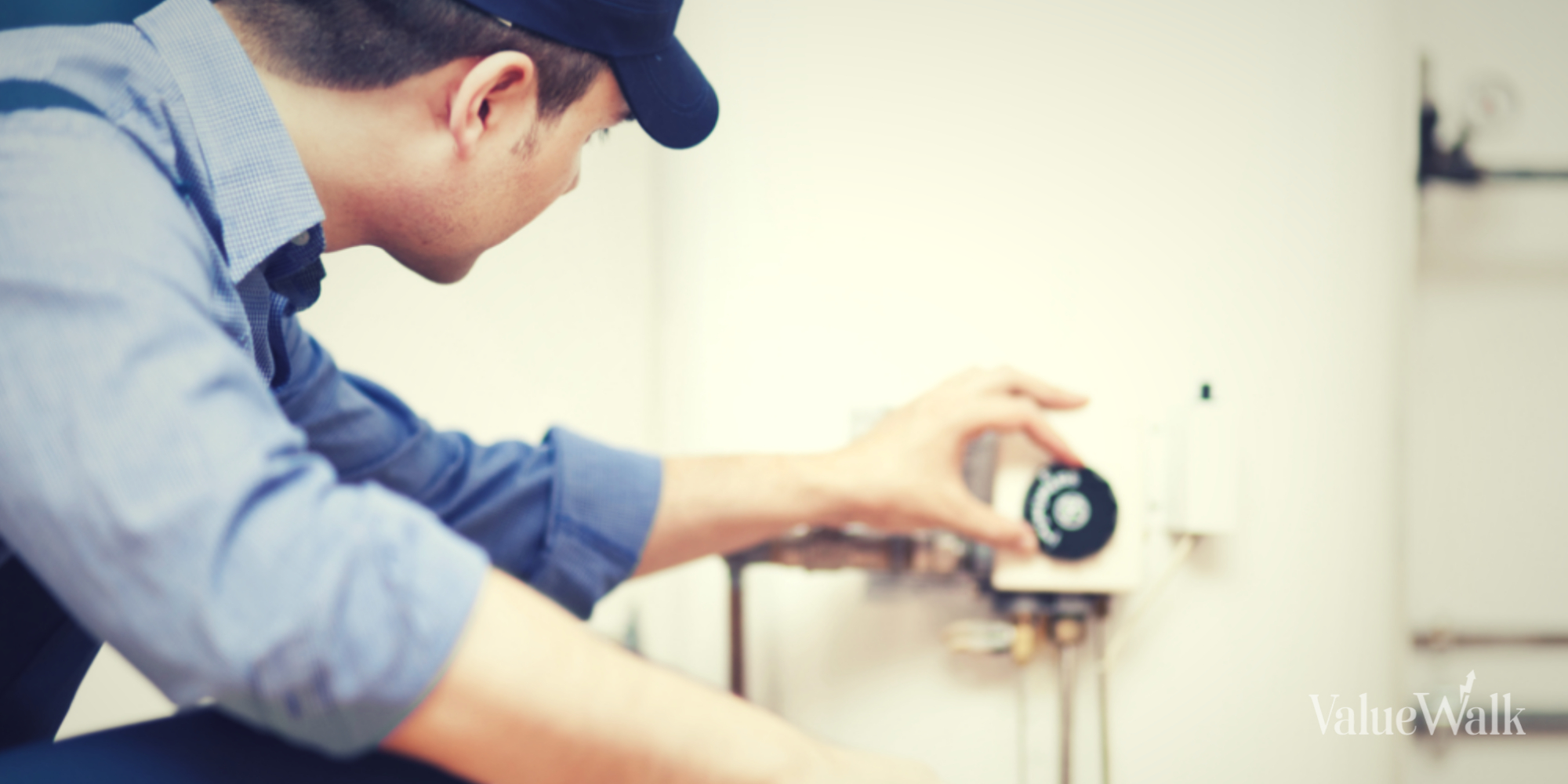 Technician servicing a hot water heater